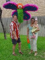 Miranda, mom & dad pose by the pi&ntilde;ata
