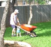 Letting Dad help me in the yard
