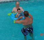 Miranda swims with daddy & grandpa Camp