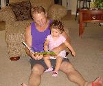 Miranda is reading to daddy